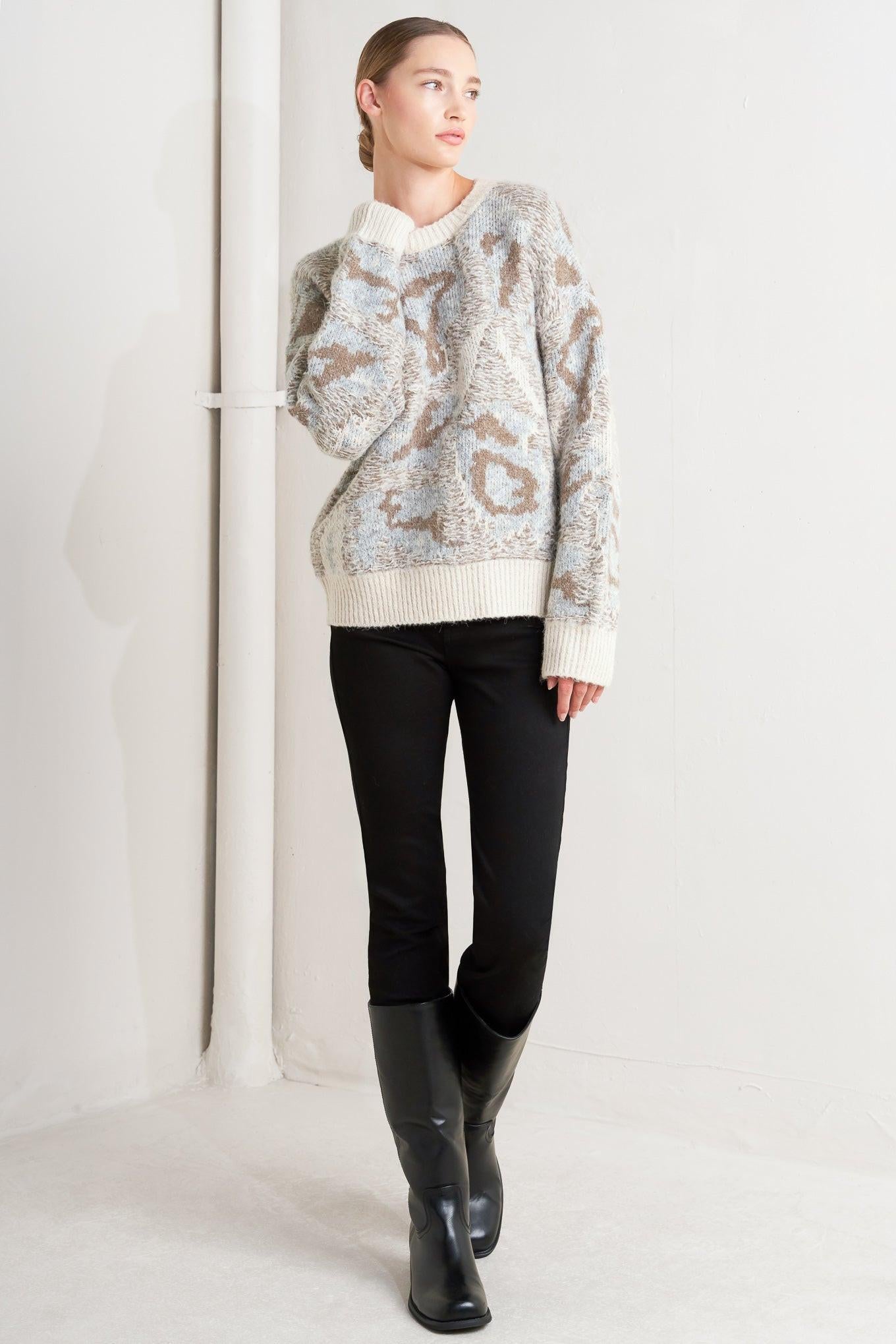 Model wearing the Flying Tomato Prominent Charm Pullover Sweater Top, styled for a comfortable and chic everyday look.