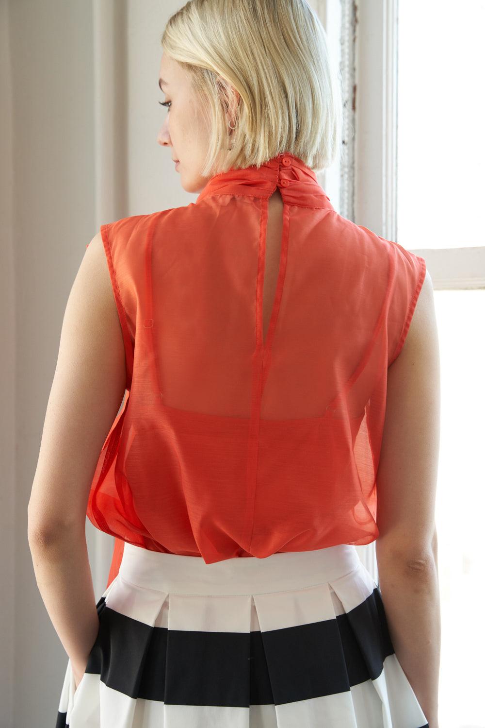 Detailed view of the Flying Tomato Shine For Us Organza Top's sheer organza fabric, emphasizing its delicate texture.