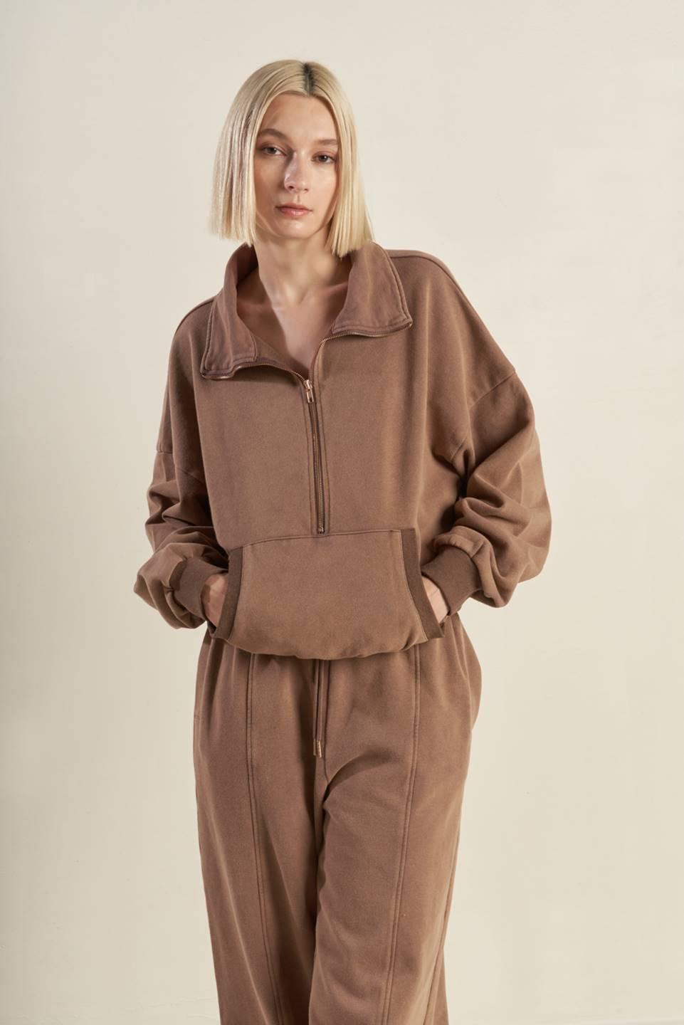 Close-up of the soft French Terry fabric on the Flying Tomato DELIGHTFUL DRAPE SWEATSHIRT from Love Salve, emphasizing its lu
