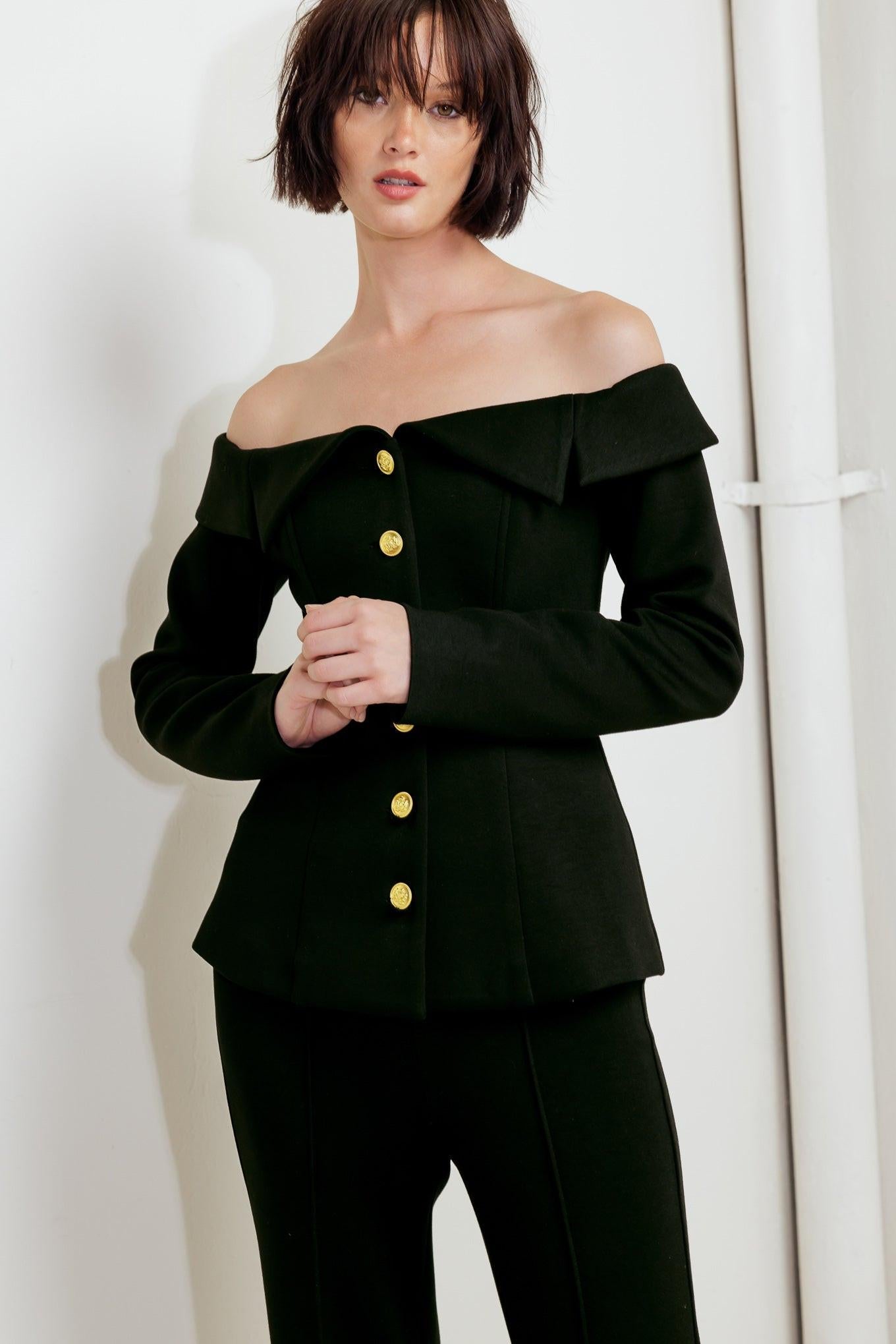Front detail of the Flying Tomato Modern Flow Black Woven Top, featuring its sophisticated neckline and textured woven fabric