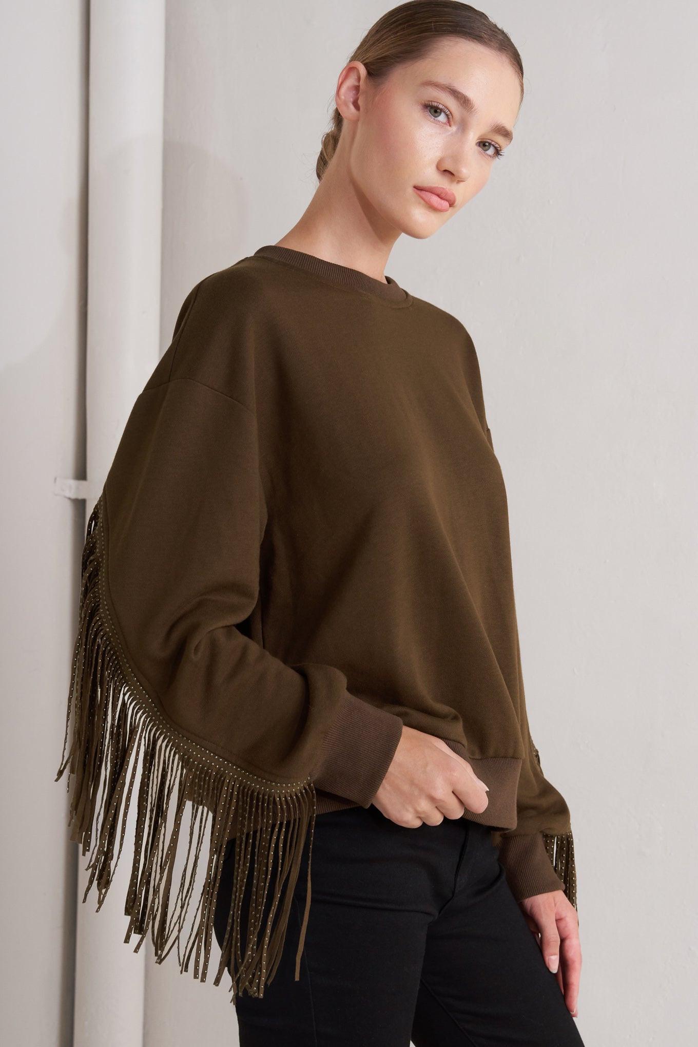 Close-up of the Flying Tomato Fringe City Pullover Knit Top, highlighting the delicate fringe and quality knit craftsmanship.