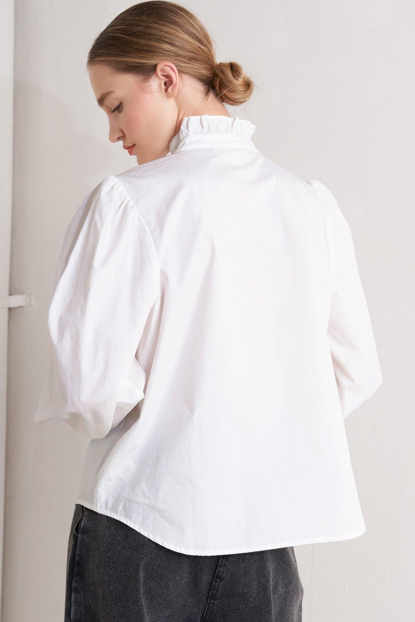 Close-up of the Flying Tomato Milk Cloud Woven Top, highlighting the intricate woven texture and soft, breathable fabric.