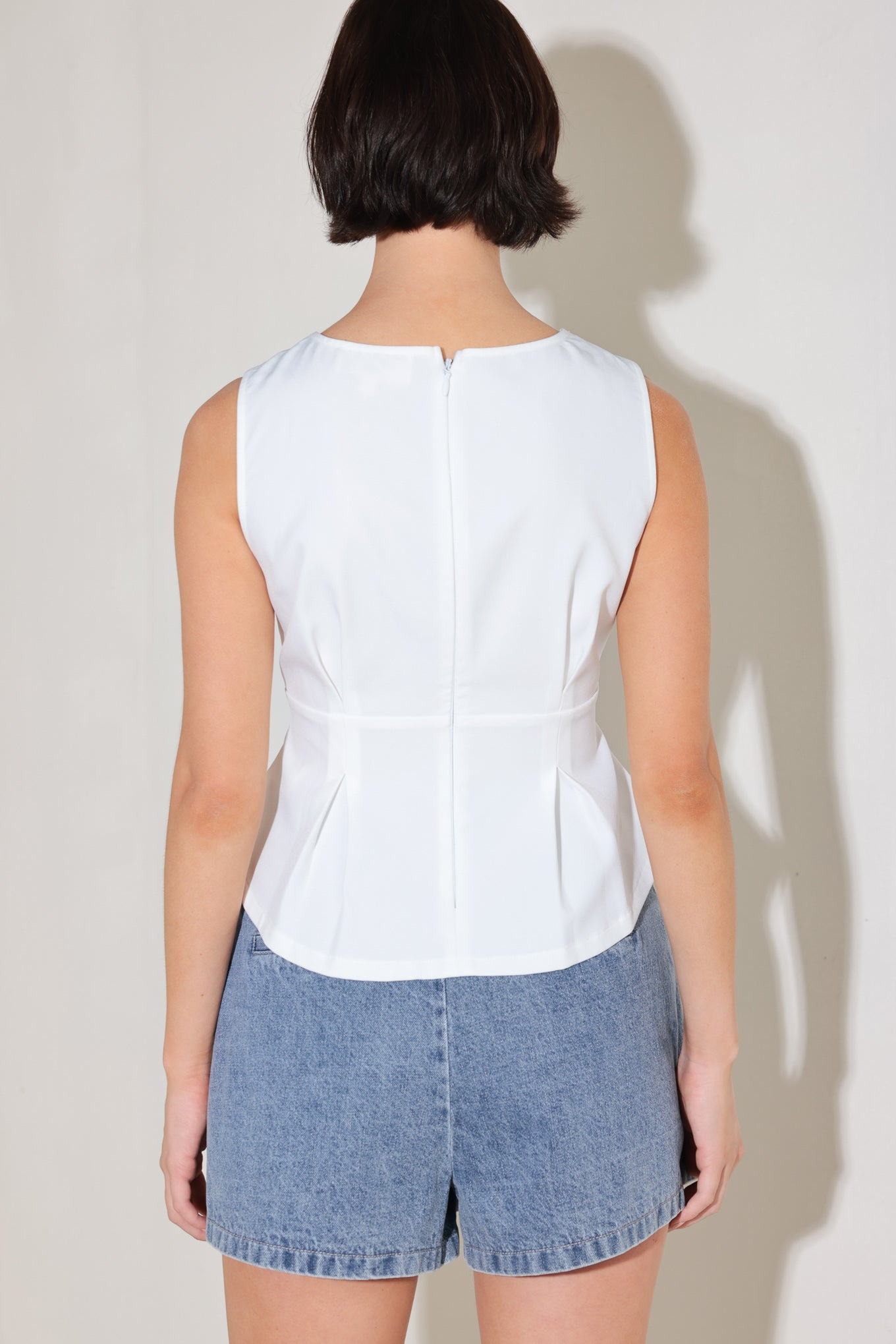 White Woven Peplum Top With Pleats And Wide Neckline Sleeveless Flying Tomato