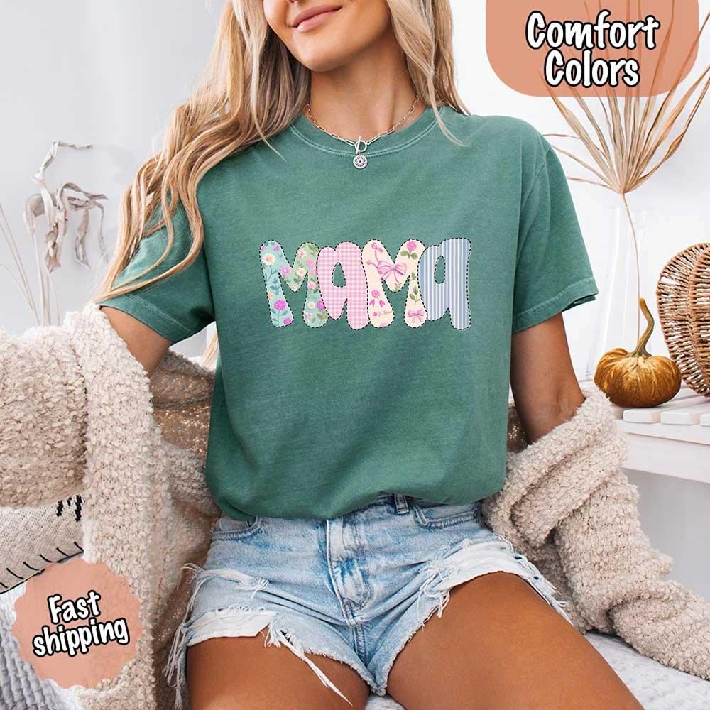 Adorb Custom Tees Floral Mama Comfort Colors Tee displayed in natural light, highlighting its soft hue and inviting texture.