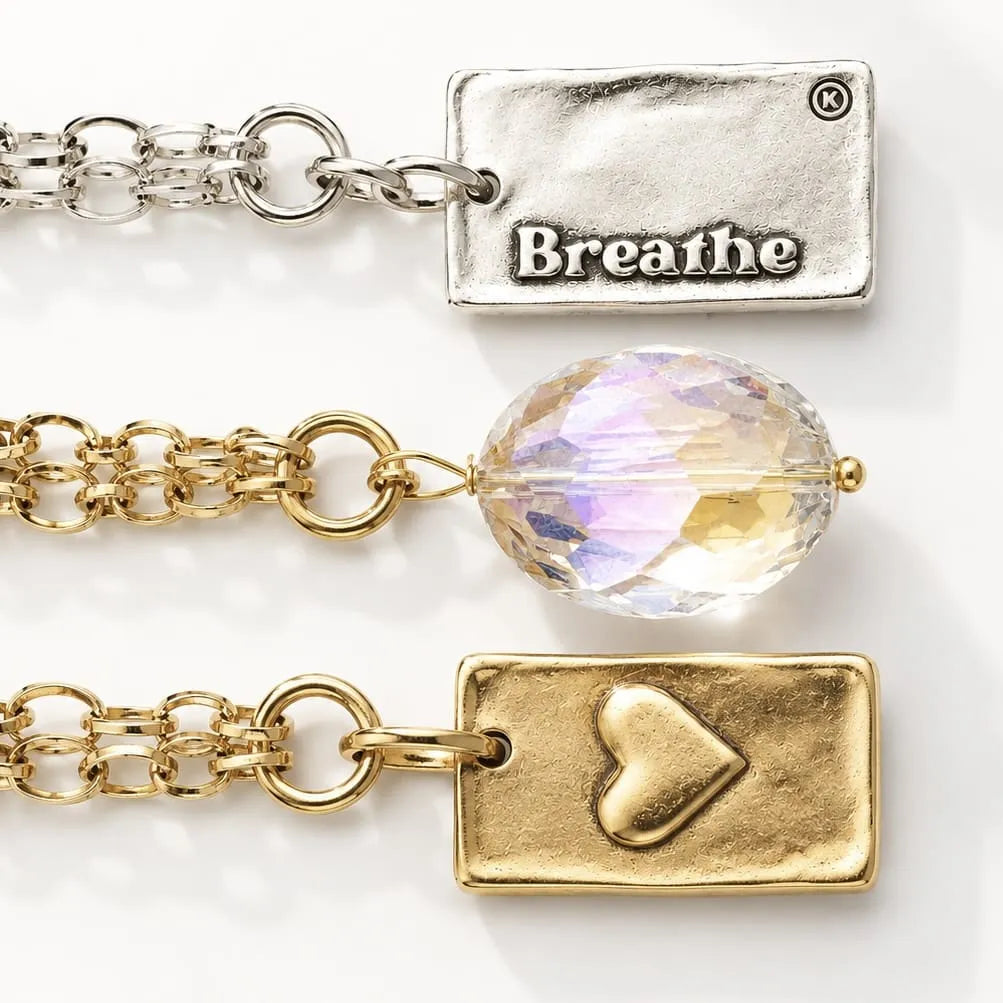 Katia Designs Breathe Original Lite Necklace, a clear aqua quartz crystal pendant on a long chain, full view.