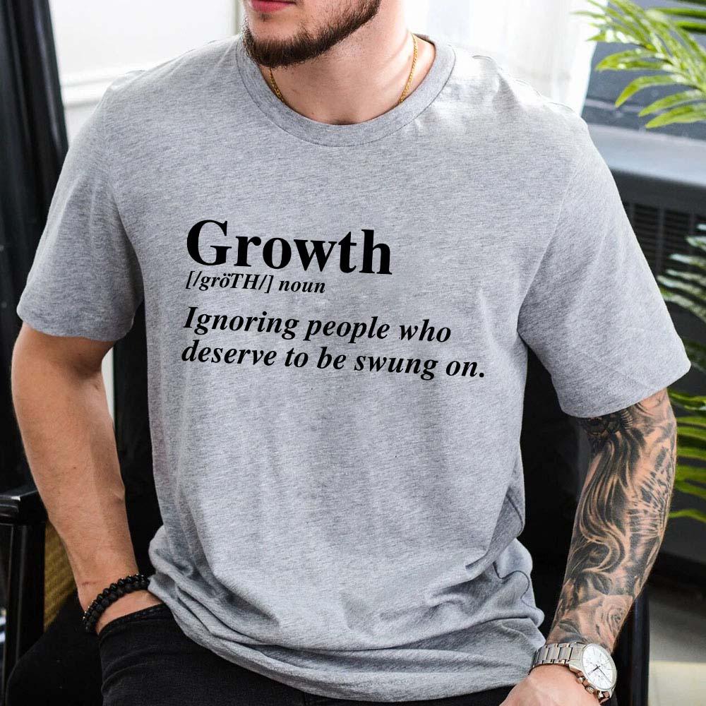 Neatly folded Adorb.co Growth Definition Graphic Tee, a thoughtful gift idea for someone seeking positive vibes.