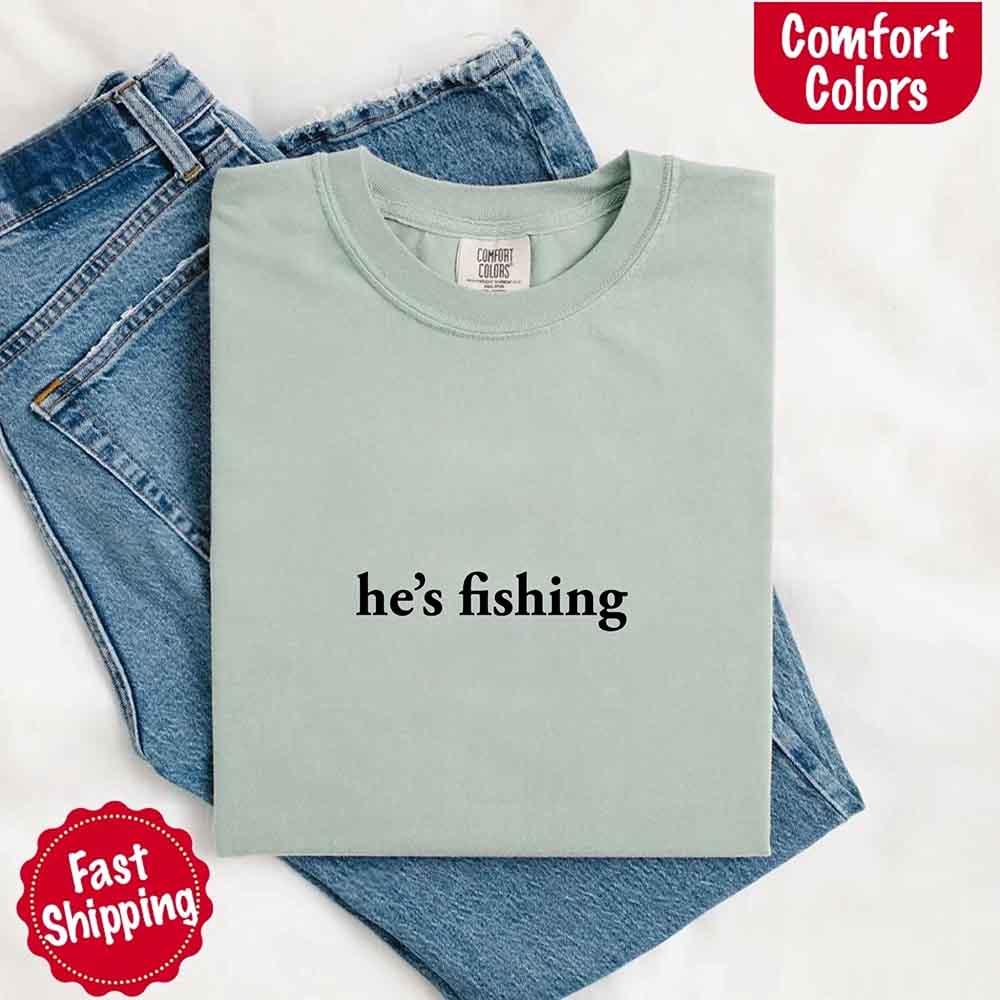 Adorb Custom Tees He's Fishing Comfort Colors Tee, a comfortable relaxed fit shirt for women, perfect for fishing enthusiasts