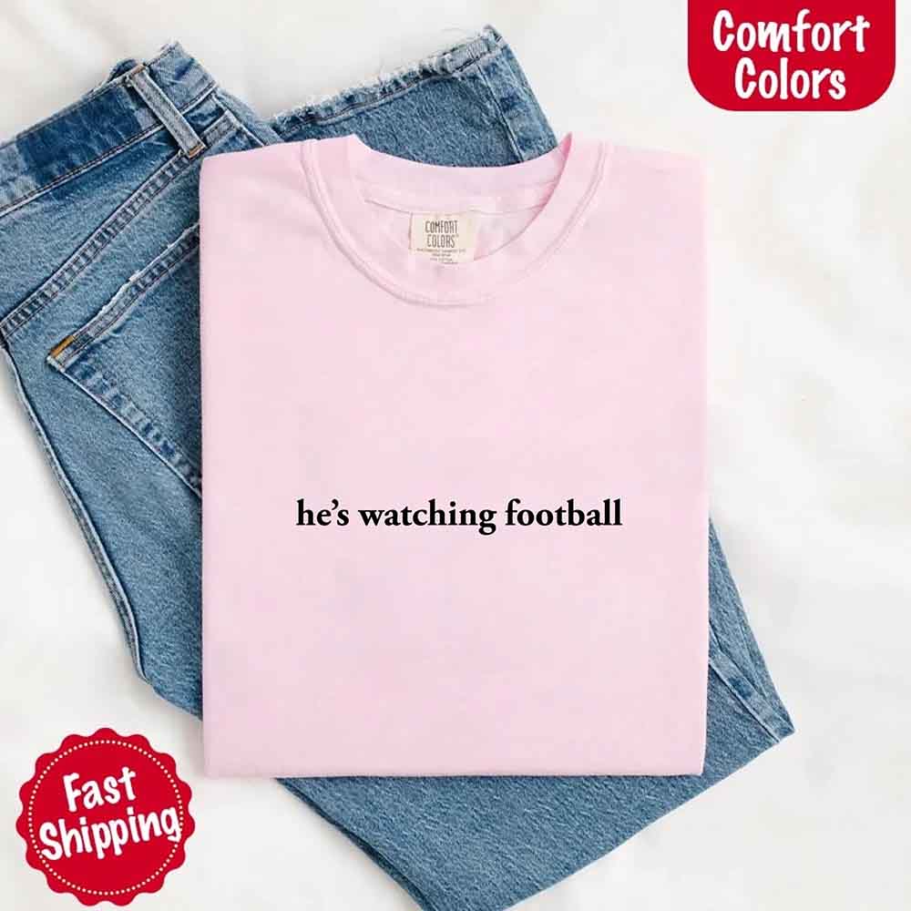 He’s Watching Football Tee - Comfort Colors Funny Shirt for Her Adorb Custom Tees