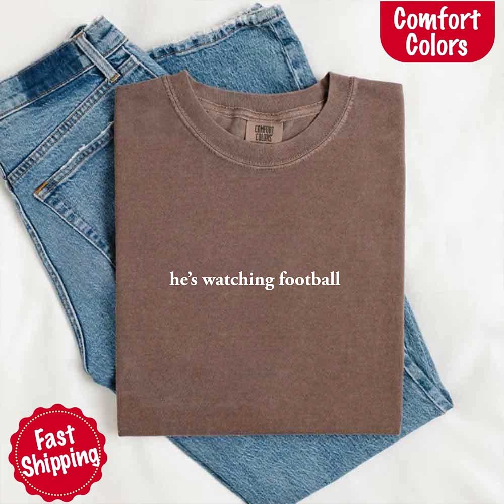 He’s Watching Football Tee - Comfort Colors Funny Shirt for Her Adorb Custom Tees