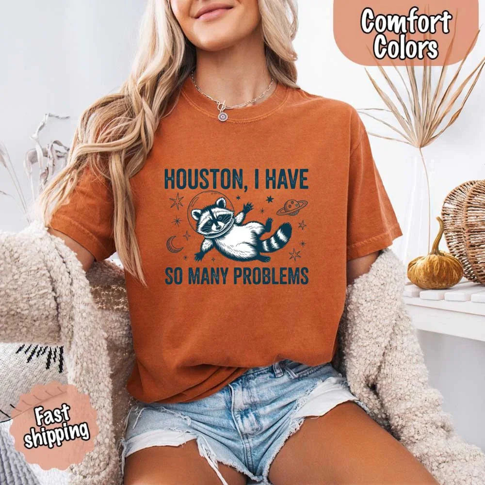A person styled in the Adorb Custom Tees raccoon meme shirt, a versatile and funny t-shirt for everyday wear.
