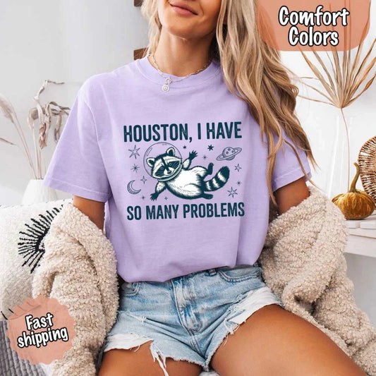 Adorb Custom Tees' Houston I Have So Many Problems Raccoon Comfort Colors T-Shirt shown on a light background.