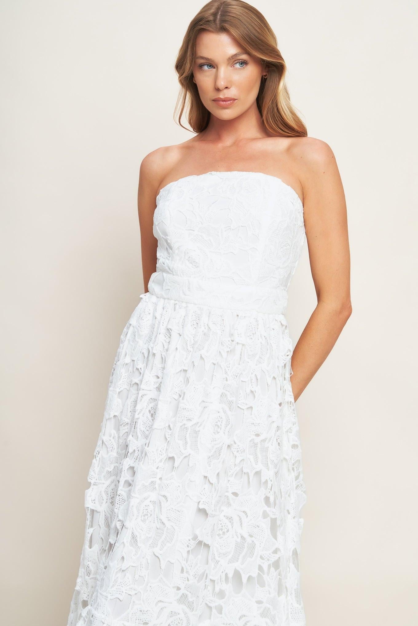 Model gracefully wearing the Flying Tomato CAREFREE NIGHTS off white lace midi dress, highlighting its elegant drape.