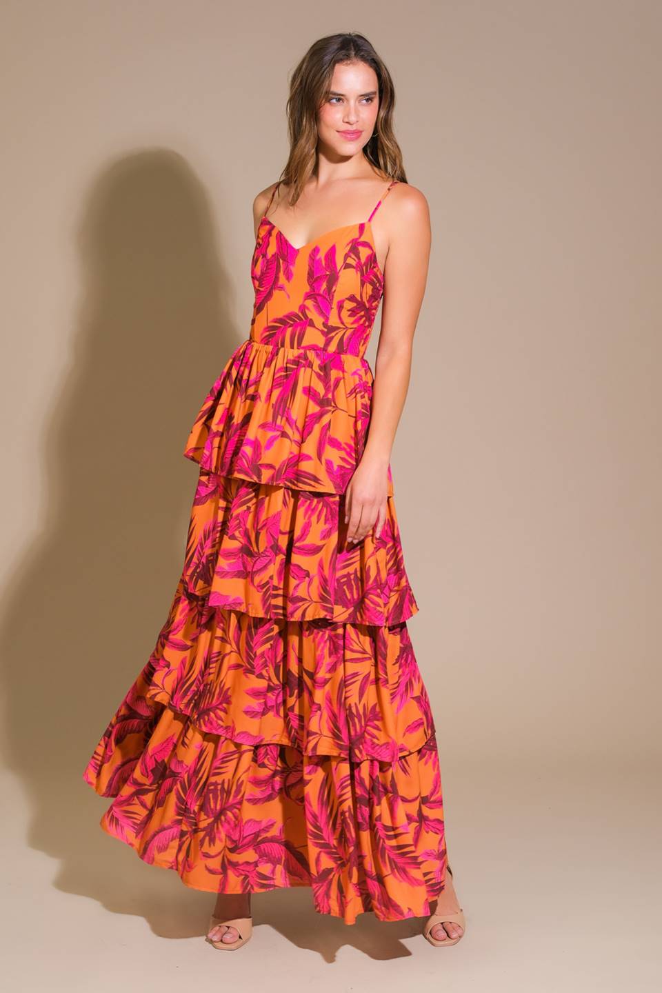 Impressive woven maxi dress with printed fabric, cami top, and layered skirt.