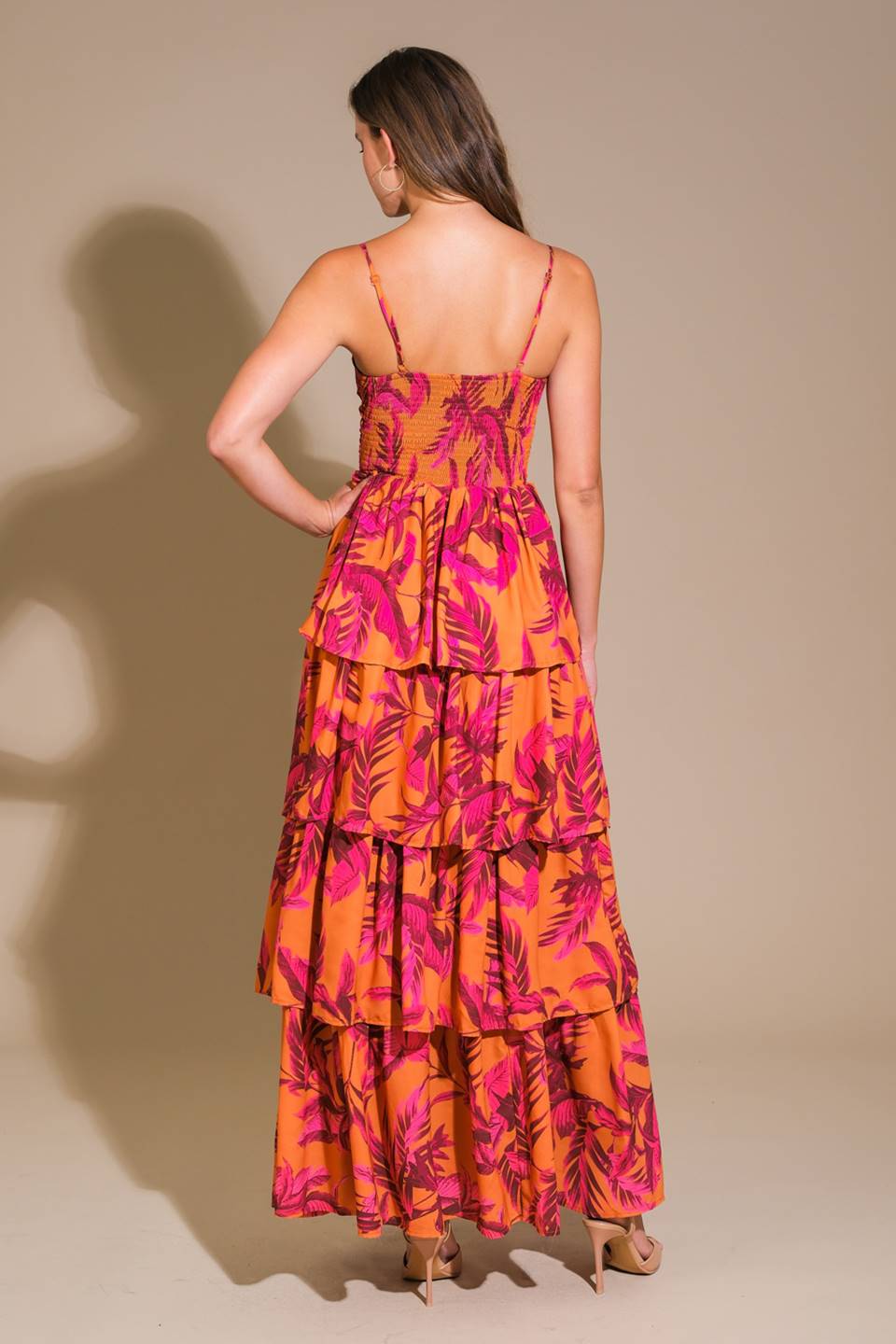 Impressive woven maxi dress with printed fabric, cami top, and layered skirt.