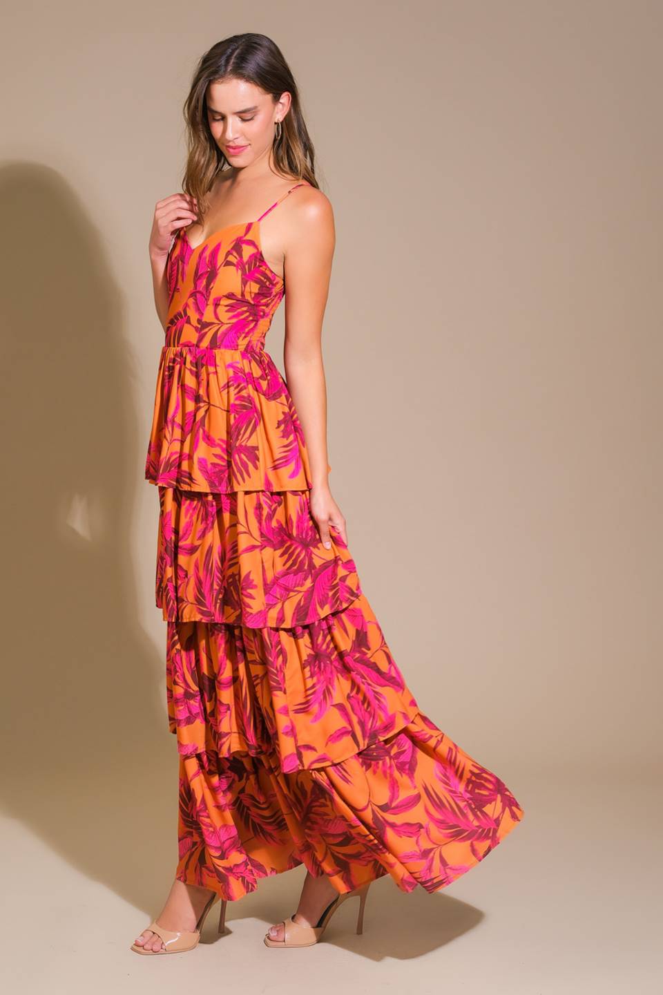 Impressive woven maxi dress with printed fabric, cami top, and layered skirt.