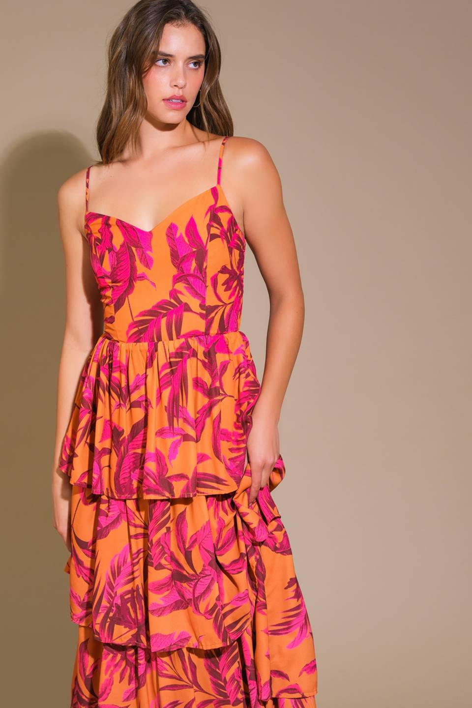 Impressive woven maxi dress with printed fabric, cami top, and layered skirt.