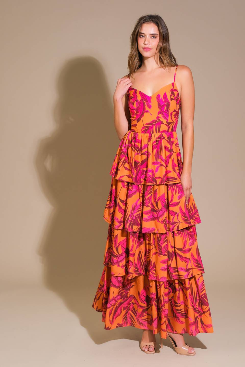 Impressive woven maxi dress with printed fabric, cami top, and layered skirt.