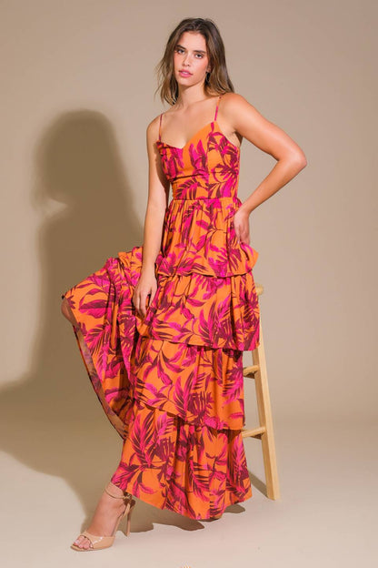 Impressive woven maxi dress with printed fabric, cami top, and layered skirt.