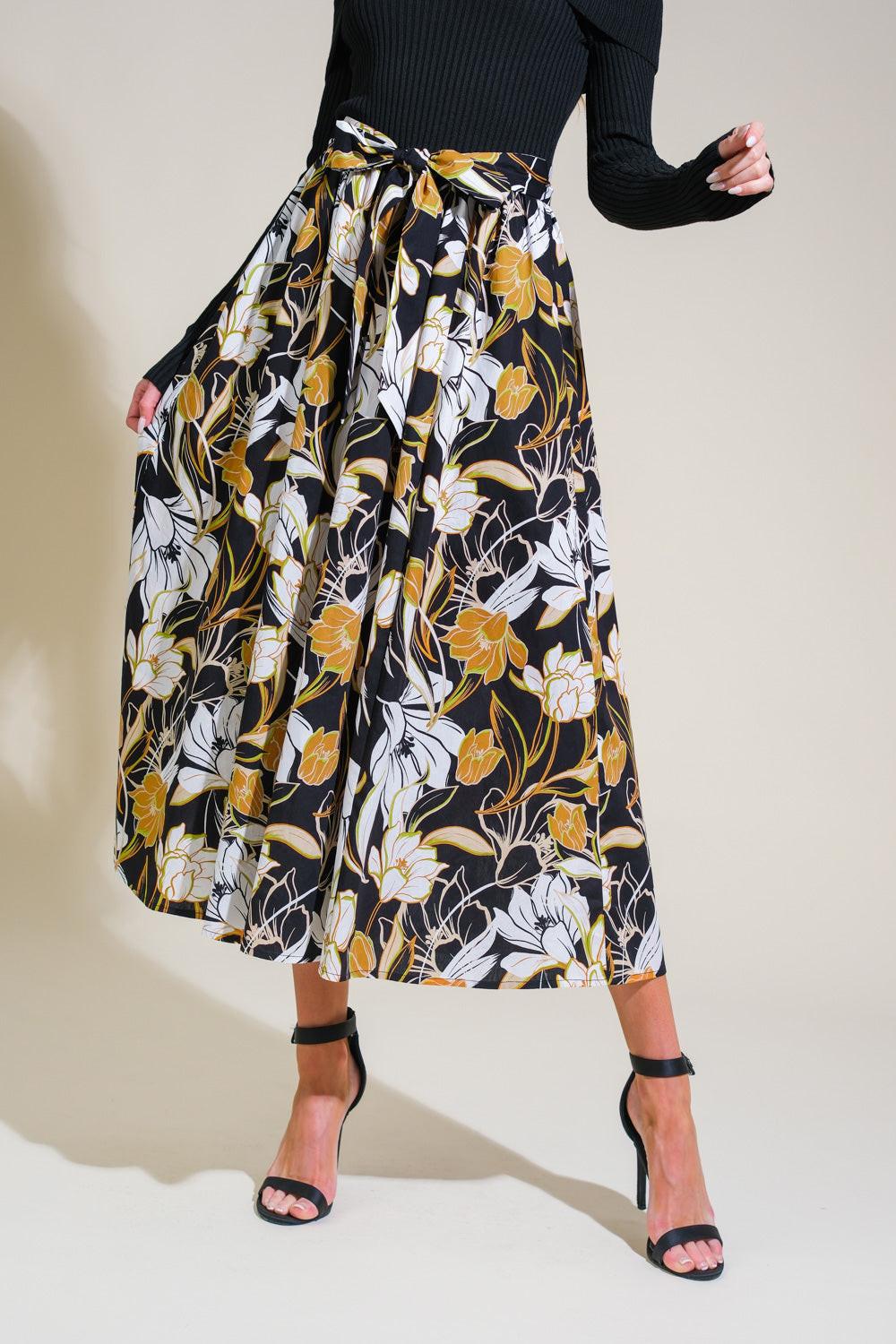 Detail shot of the Flying Tomato TWIST ON TIMELESS WOVEN MIDI DRESS, highlighting its unique 'twist' design element.