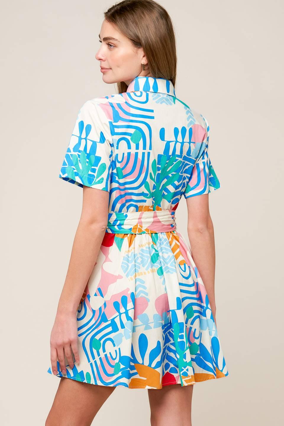 Detailed view of the Flying Tomato Garden Social Woven Mini Dress's unique fabric pattern, emphasizing its rich texture and q