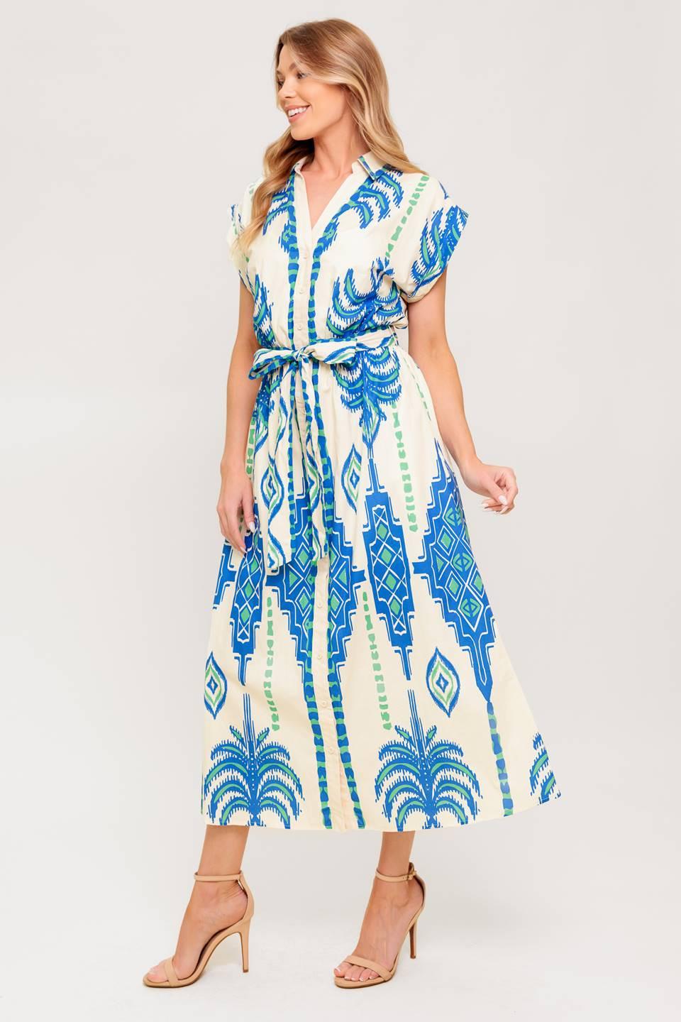 Close-up detail of the SOFTLY SPOKEN BLUE WOVEN MIDI DRESS fabric, revealing the delicate weave and rich blue hue.