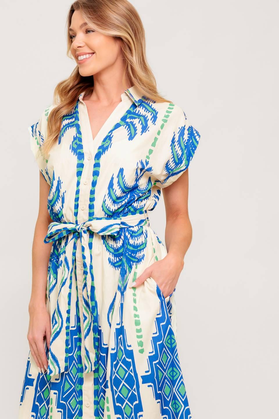 Detail shot of the SOFTLY SPOKEN BLUE WOVEN MIDI DRESS neckline and sleeve, showcasing the thoughtful design elements.