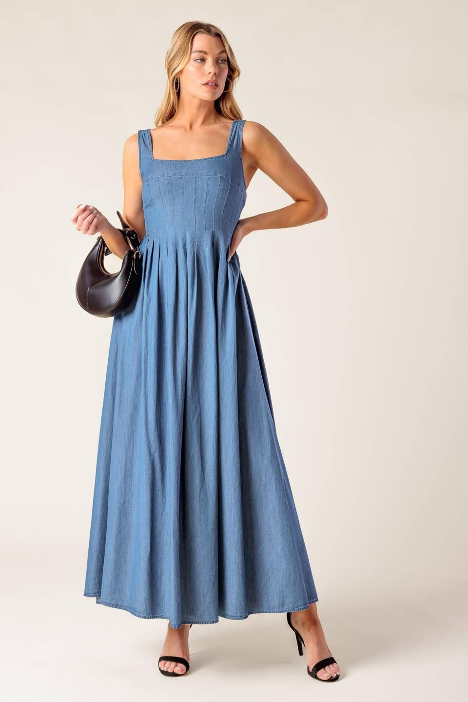 Close-up detail of the Flying Tomato PASSIFLORA INDIGO DENIM MIDI DRESS, focusing on the intricate stitching and button detai