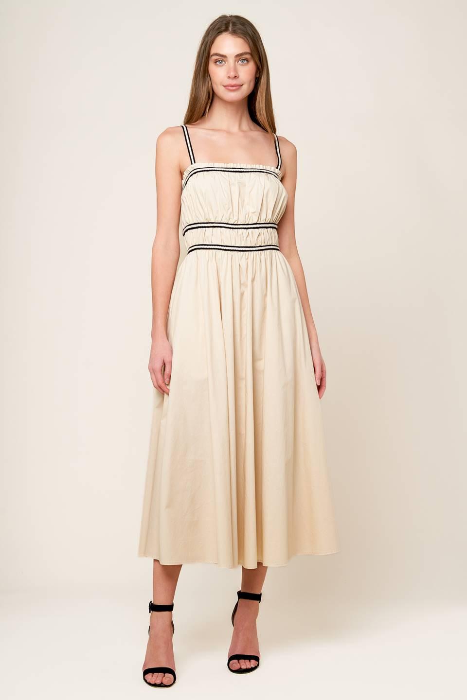 Model wearing the Flying Tomato Terrific Timing Cream Woven Midi Dress, demonstrating its comfortable fit and movement.