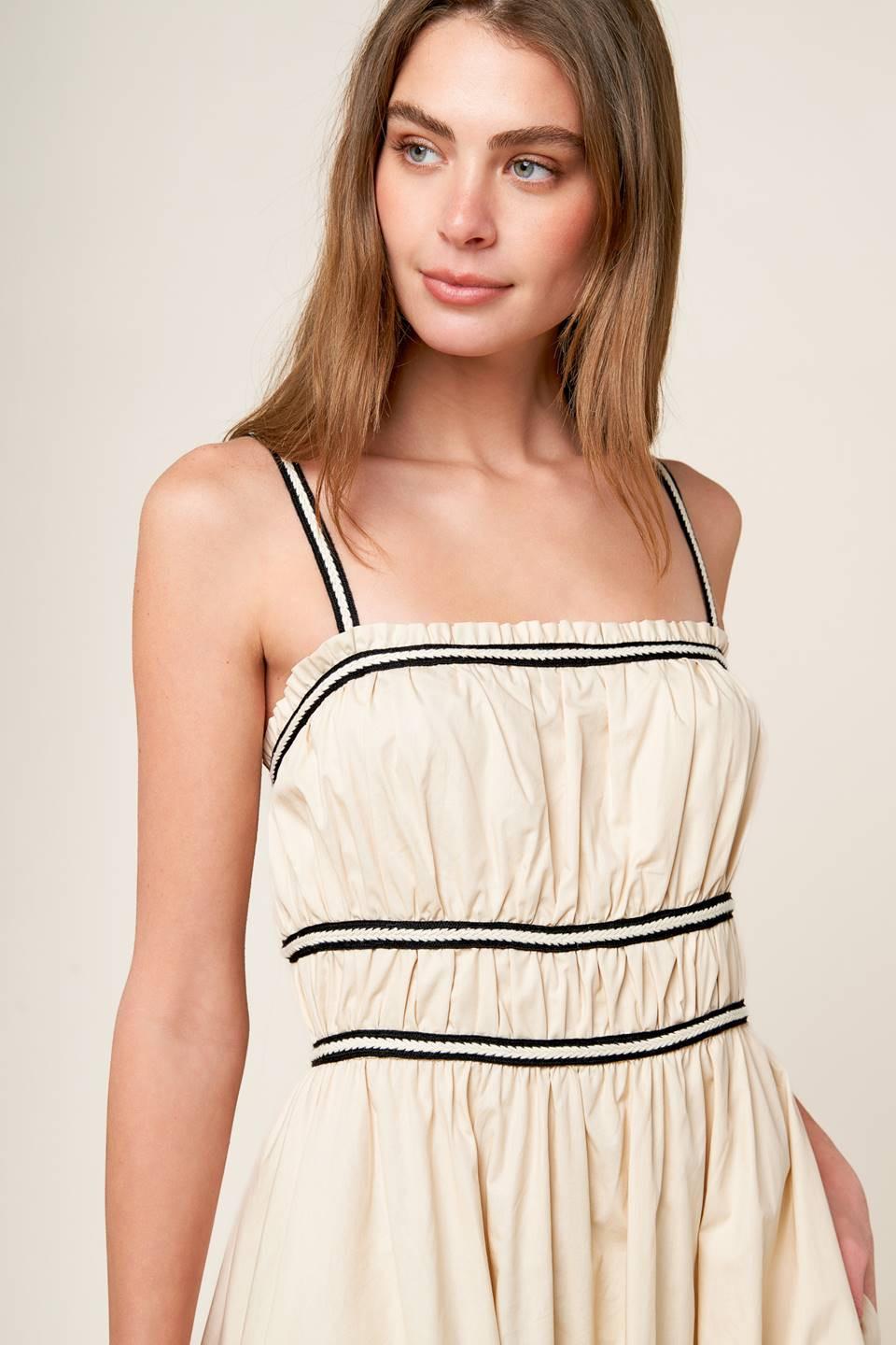 Detail shot of the neckline and sleeves of the Flying Tomato Terrific Timing Cream Woven Midi Dress, elegant design.