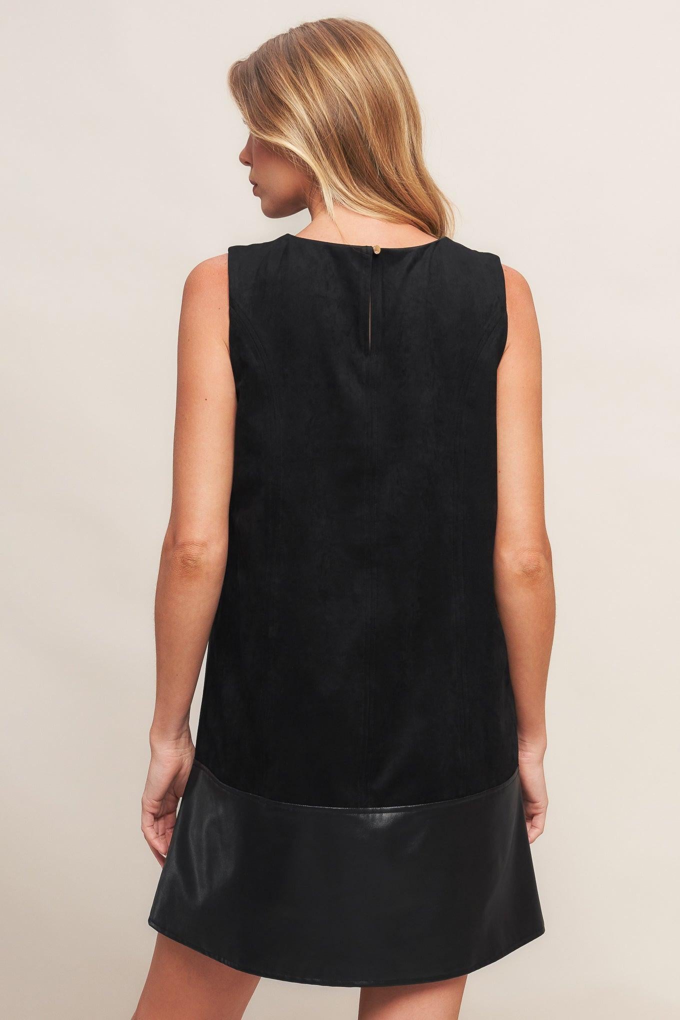 Rear view of the Flying Tomato CITY SLEEK FAUX SUEDE AND LEATHER SHIFT DRESS, revealing its sophisticated cut and design.