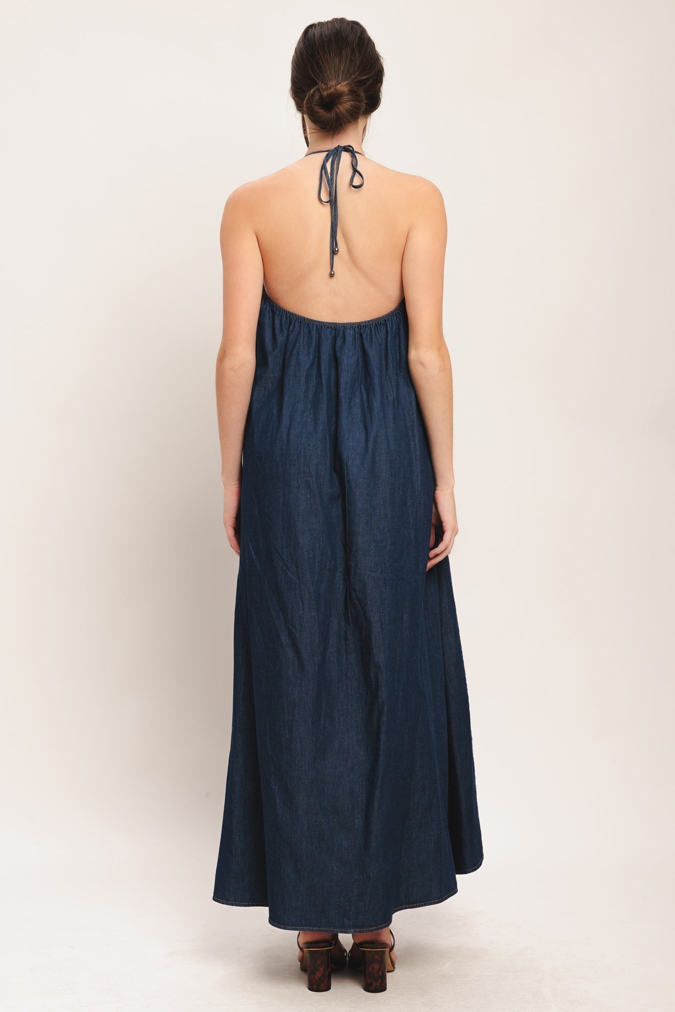 Quiet Statement Denim Midi Dress With Bib Neckline And Back Tie Flying Tomato