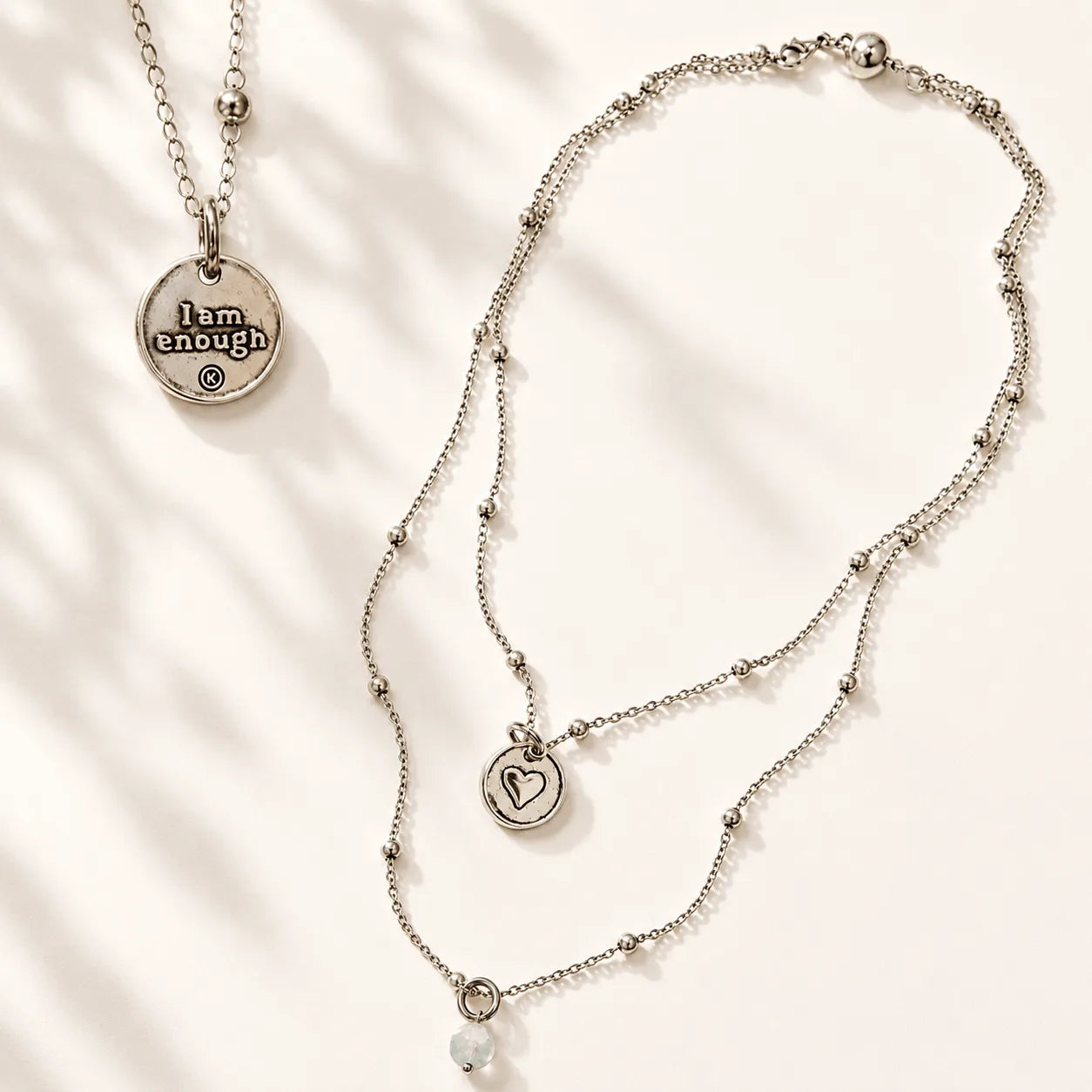 Katia Designs I Am Enough Heart Dainty Necklace, showcasing the engraved heart pendant and delicate chain for elegant wear.