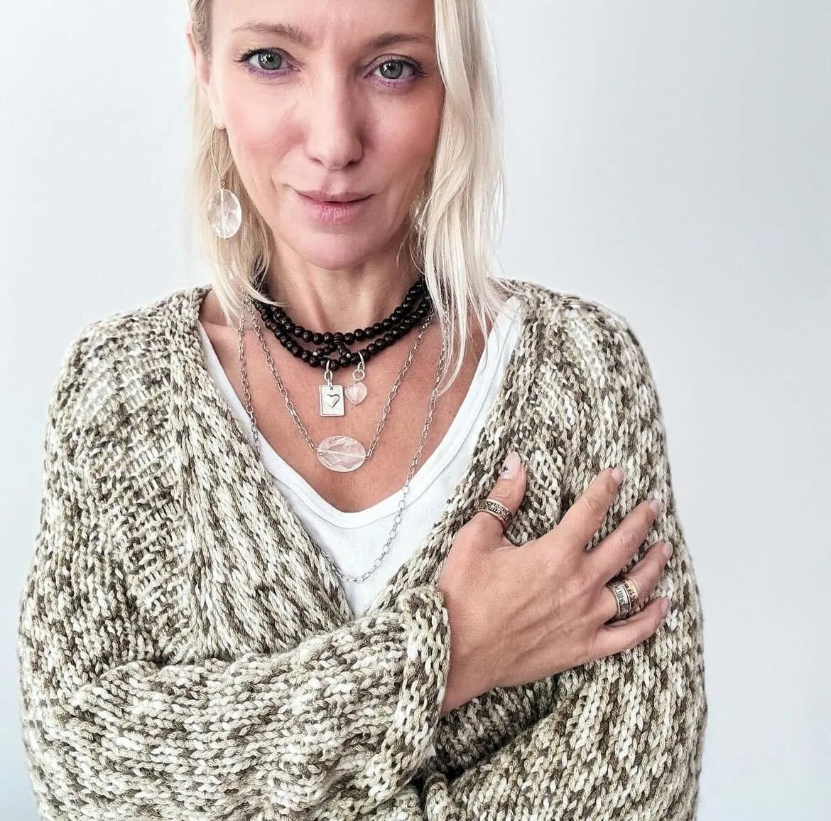 Katia Designs Grateful Thankful Blessed Heart Wood Boho Necklace, styled to highlight its elegant length and natural material
