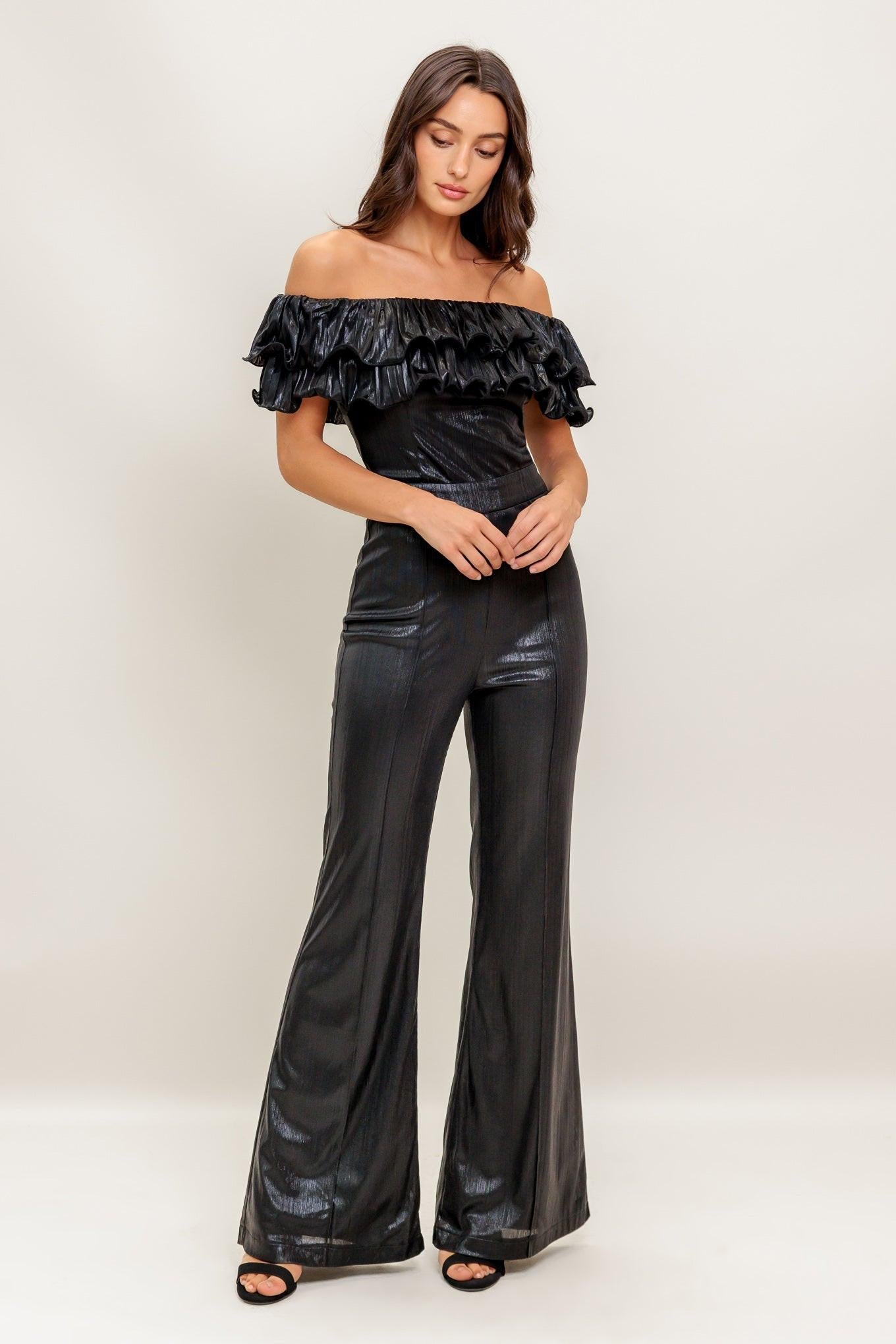 Flying Tomato ANGEL EYES COATED WOVEN JUMPSUIT, styled for a modern look, emphasizing its fluid drape and fashionable appeal.