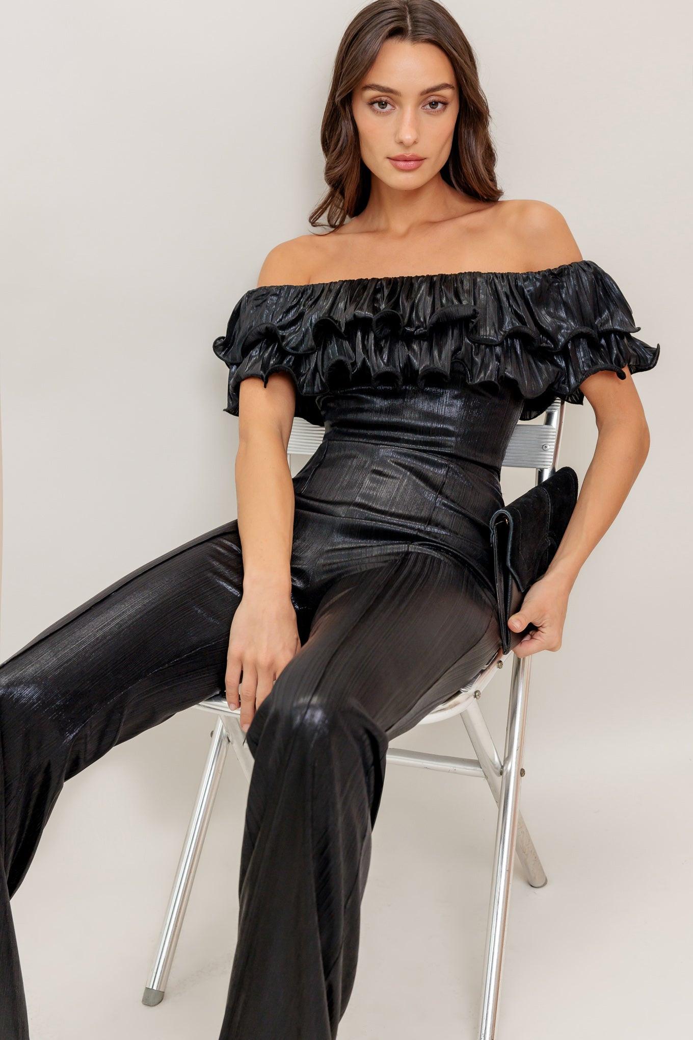 Detailed view of the Flying Tomato ANGEL EYES Jumpsuit's unique coated woven fabric texture, highlighting its quality finish.