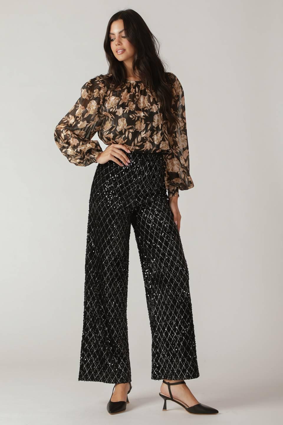 Model wearing Flying Tomato Running Out of Time Sequin Pants, demonstrating their elegant drape and stylish appeal.