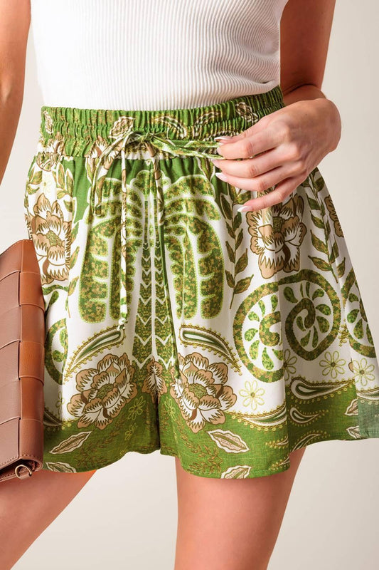 Flying Tomato DISTANT ECHOES GREEN SHORTS shown from the front. Stylish shorts featuring a unique, abstract green pattern.