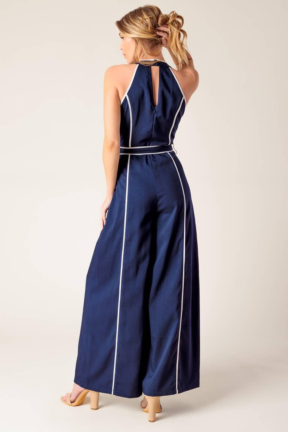 Flying Tomato Layton Navy Woven Jumpsuit, highlighting the chic back design and comfortable, flowing silhouette.