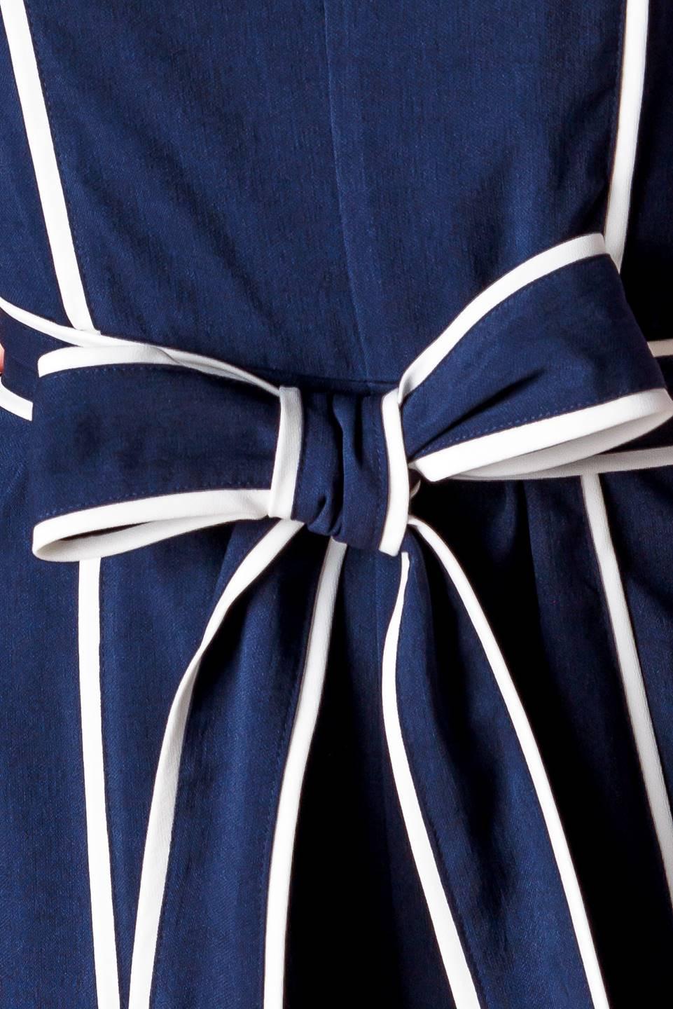 Flying Tomato Layton Navy Woven Jumpsuit, showcasing its thoughtful design details and enduring navy color.