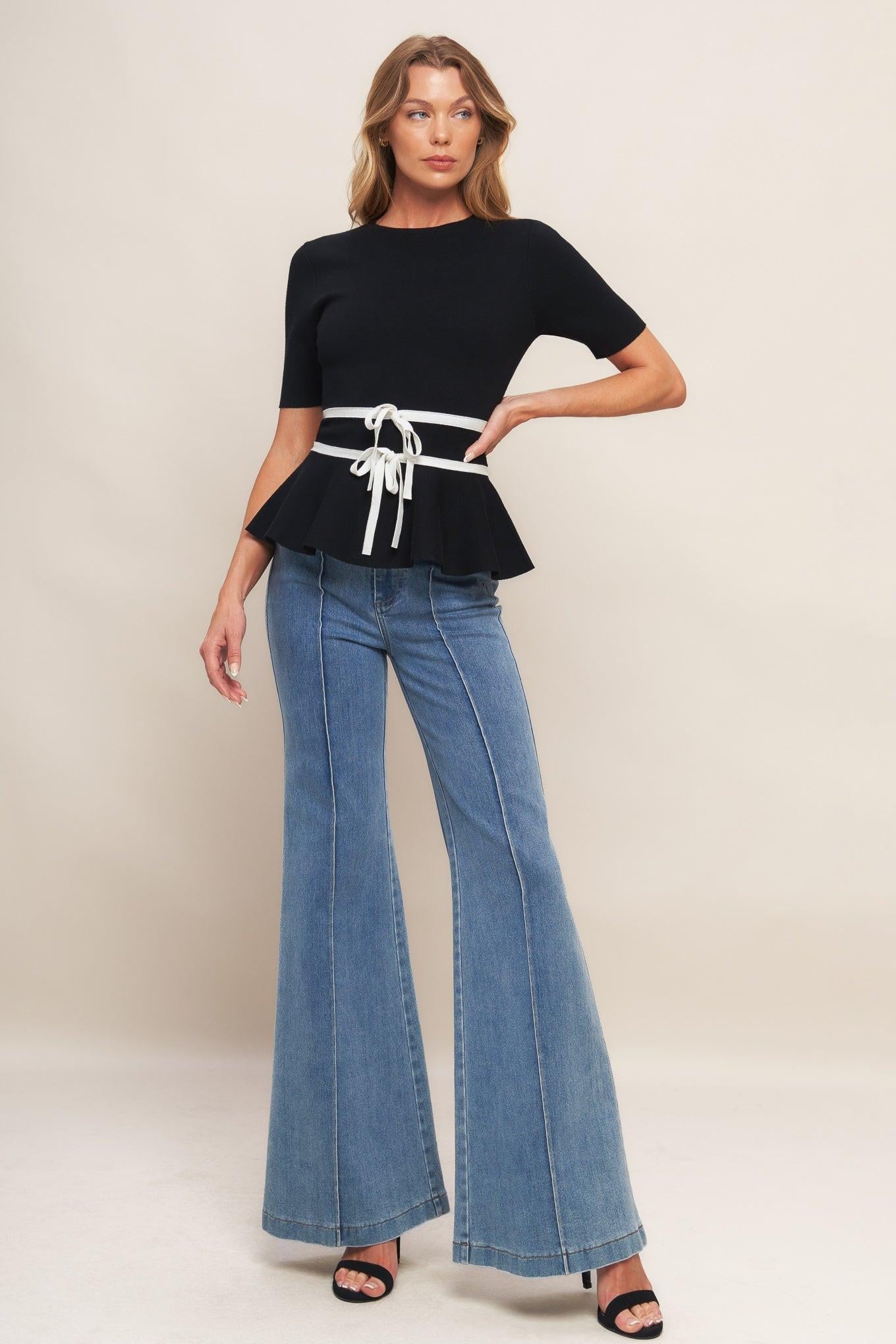 Back view of the Flying Tomato SUNLIT GROVE BLACK SWEATER KNIT TOP, showcasing its elegant drape and thoughtful design.