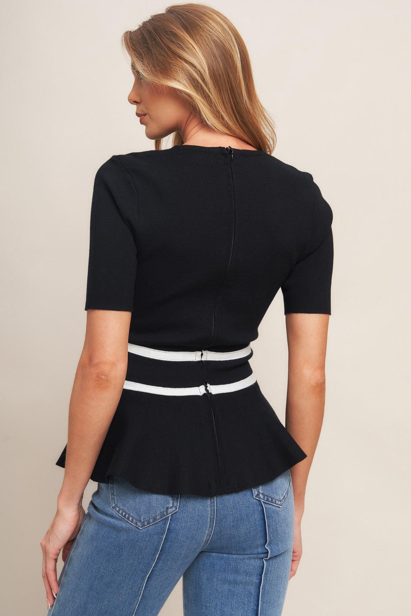 Model wearing the Flying Tomato SUNLIT GROVE BLACK SWEATER KNIT TOP, demonstrating its versatile style and comfortable fit.