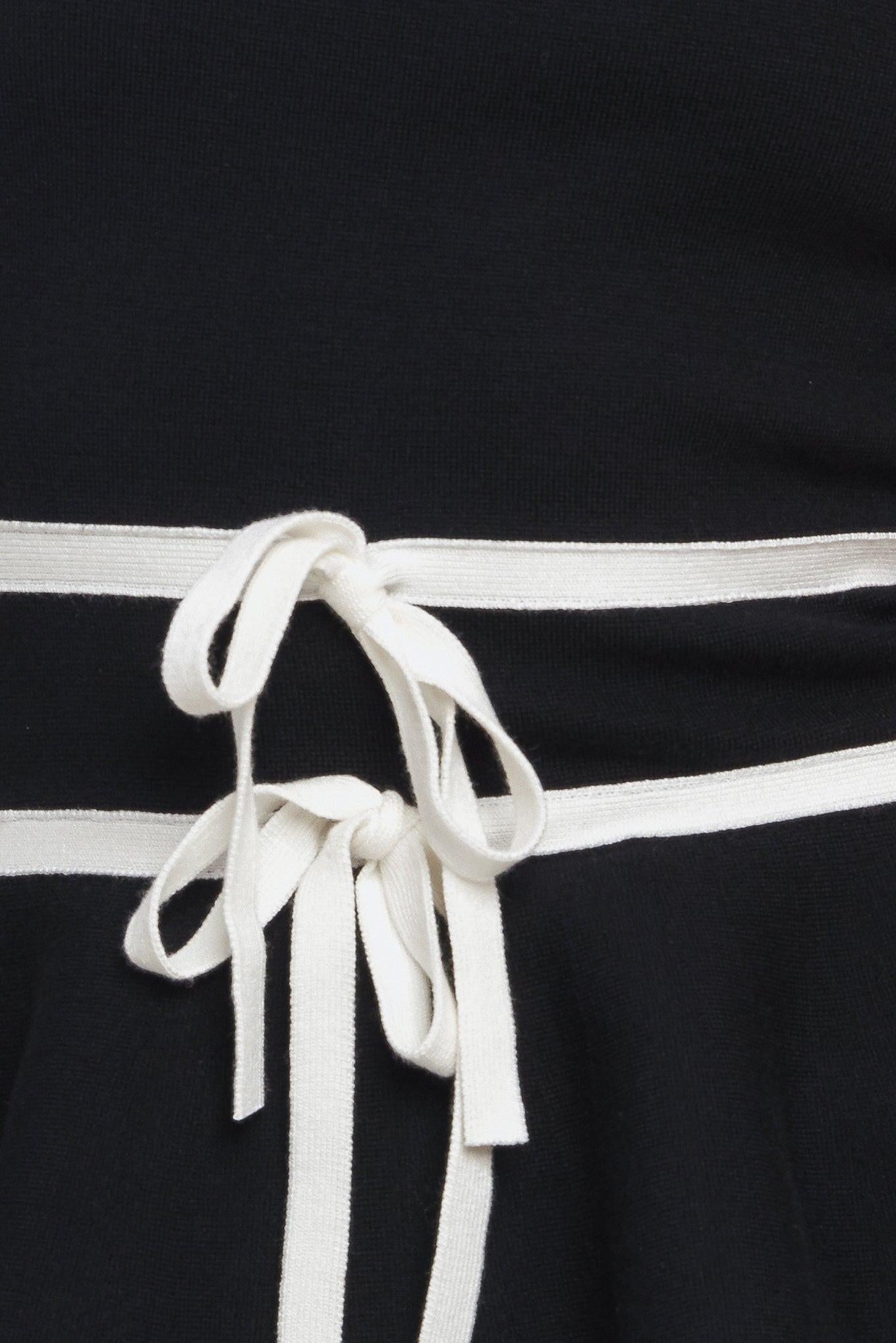 Detail shot of the Flying Tomato SUNLIT GROVE BLACK SWEATER KNIT TOP, emphasizing the premium knit material and craftsmanship