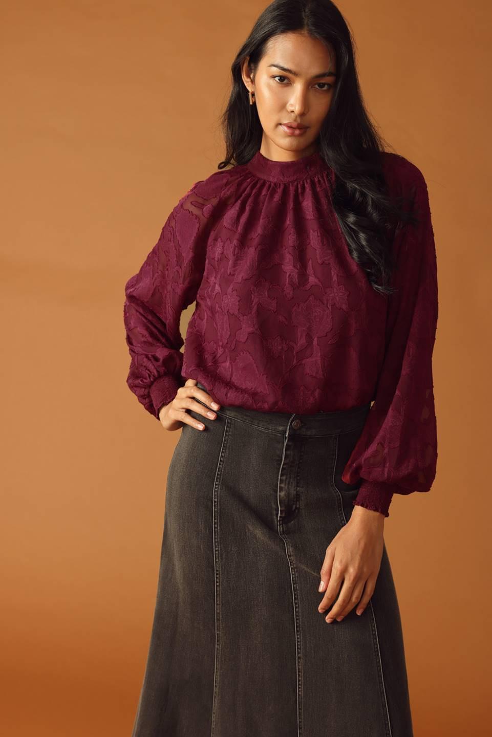 Flying Tomato Solaris Dream Woven Top, showcasing its flowing back design and breathable woven fabric, ideal for a chic look.