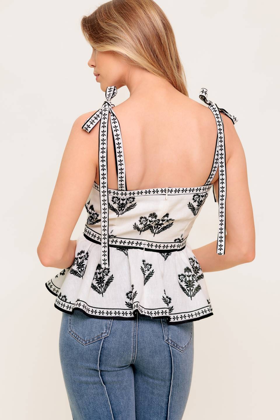 Serene Kiss Woven Top Printed With Shoulder Tie Peplum