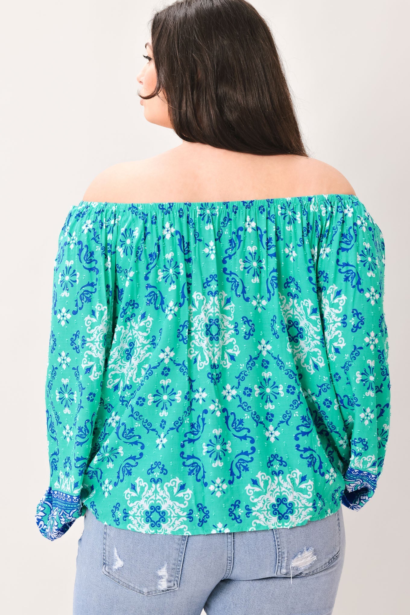 Flying Tomato Send My Love Woven Top from Love Salve, showing a side view that emphasizes its flowy silhouette and soft woven