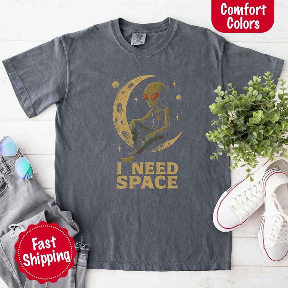 Adorb Custom Tees I Need Space Tee styled for a casual, alternative look. Demonstrates versatile unisex comfort and fashion.