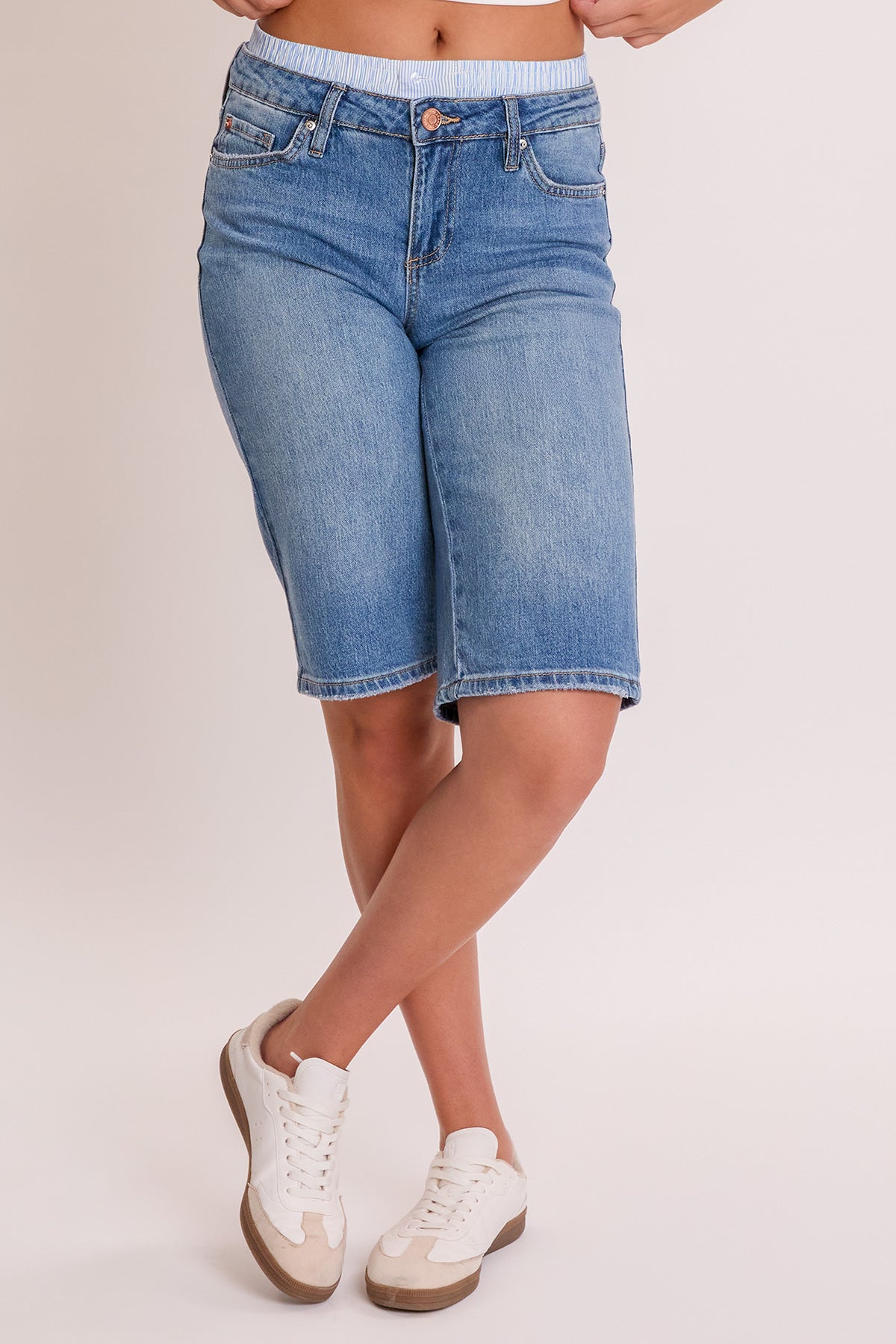 Side profile of the YMI JEANS Women's Luxe Jort, displaying the flattering mid-rise fit and denim texture.