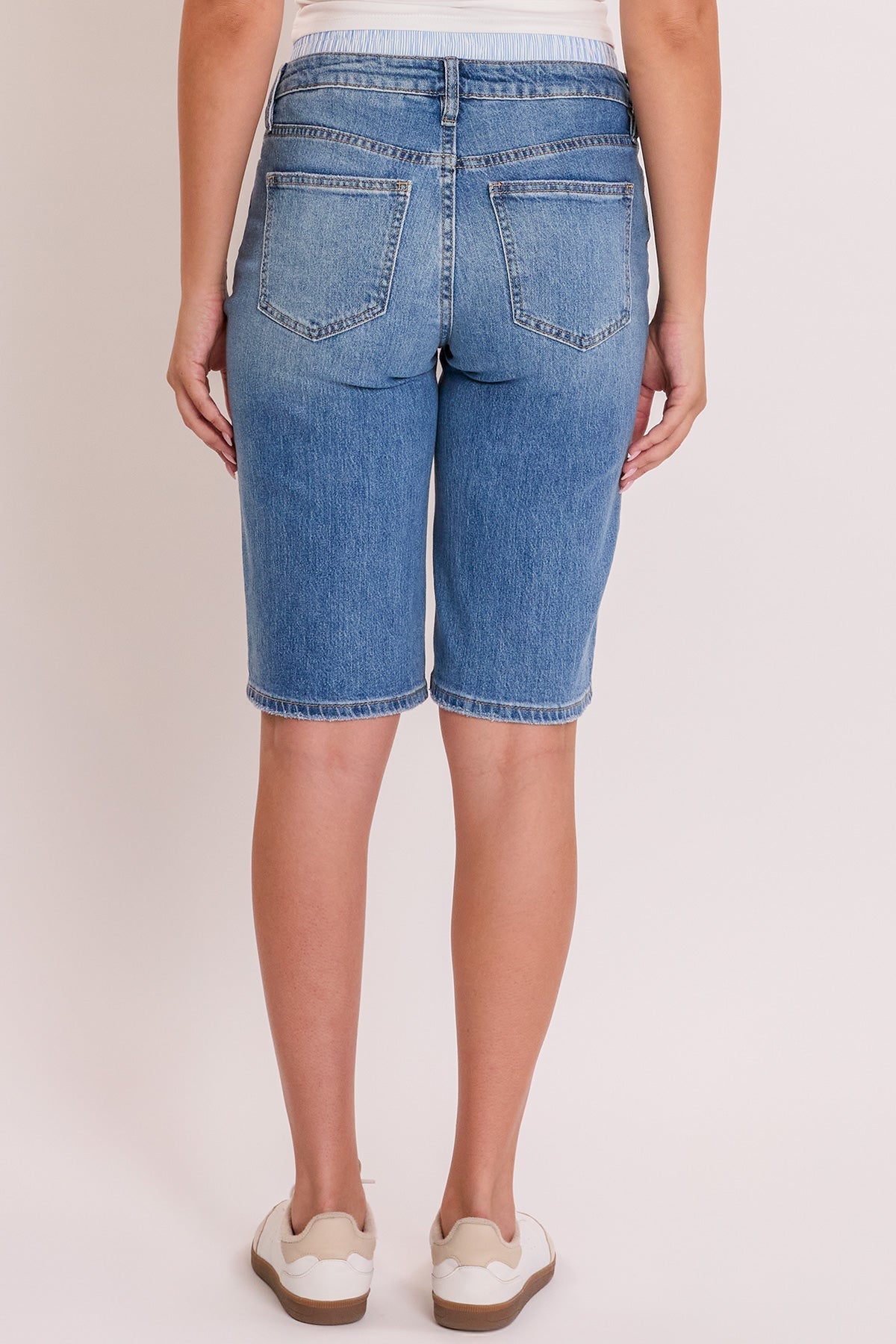 A closer look at the YMI JEANS Luxe Jort's hemline, featuring the durable stretch denim material and casual style.
