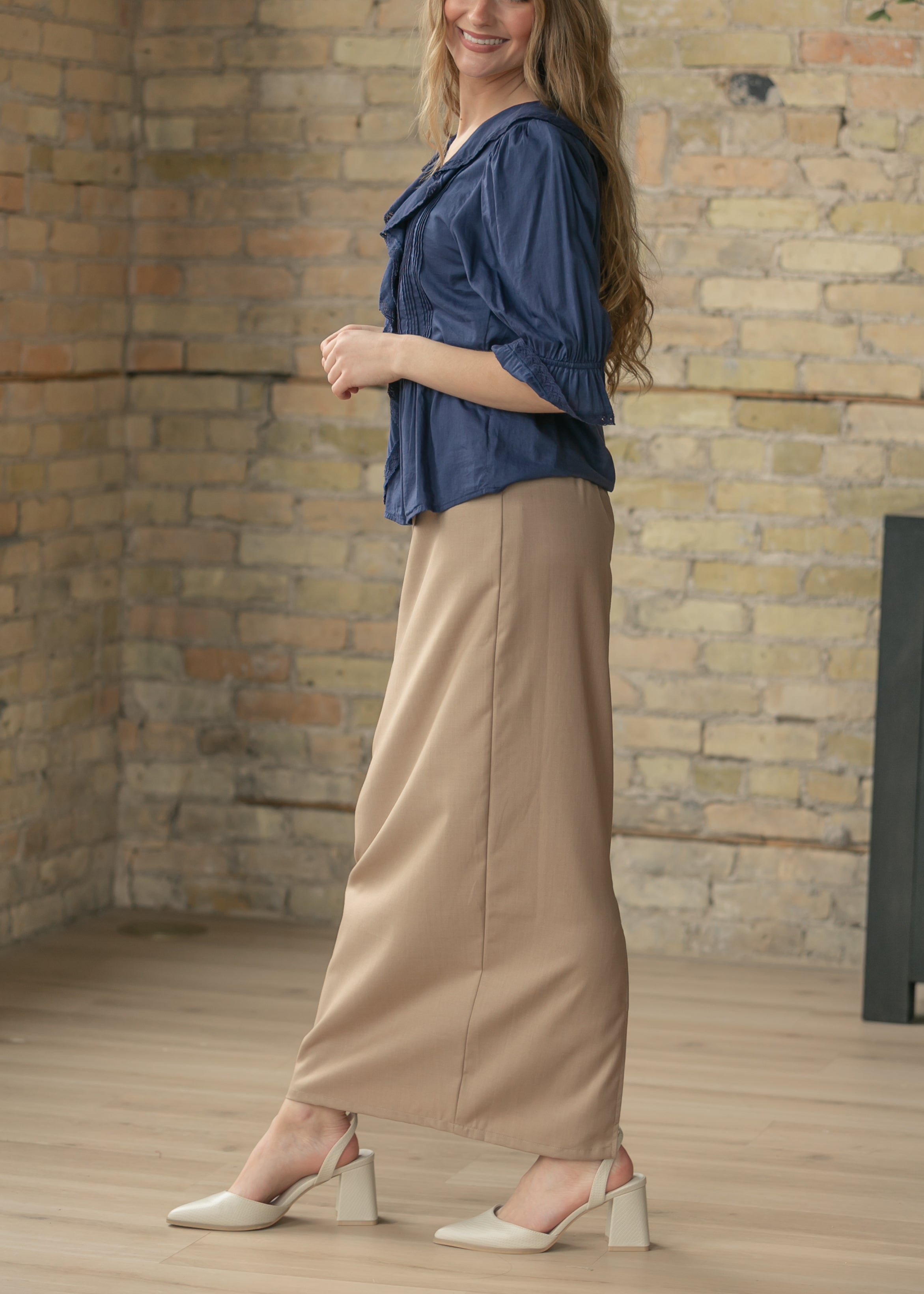 Model walking in the Inherit Co. Hollis Long Maxi Skirt, demonstrating the comfortable movement and elegant drape.