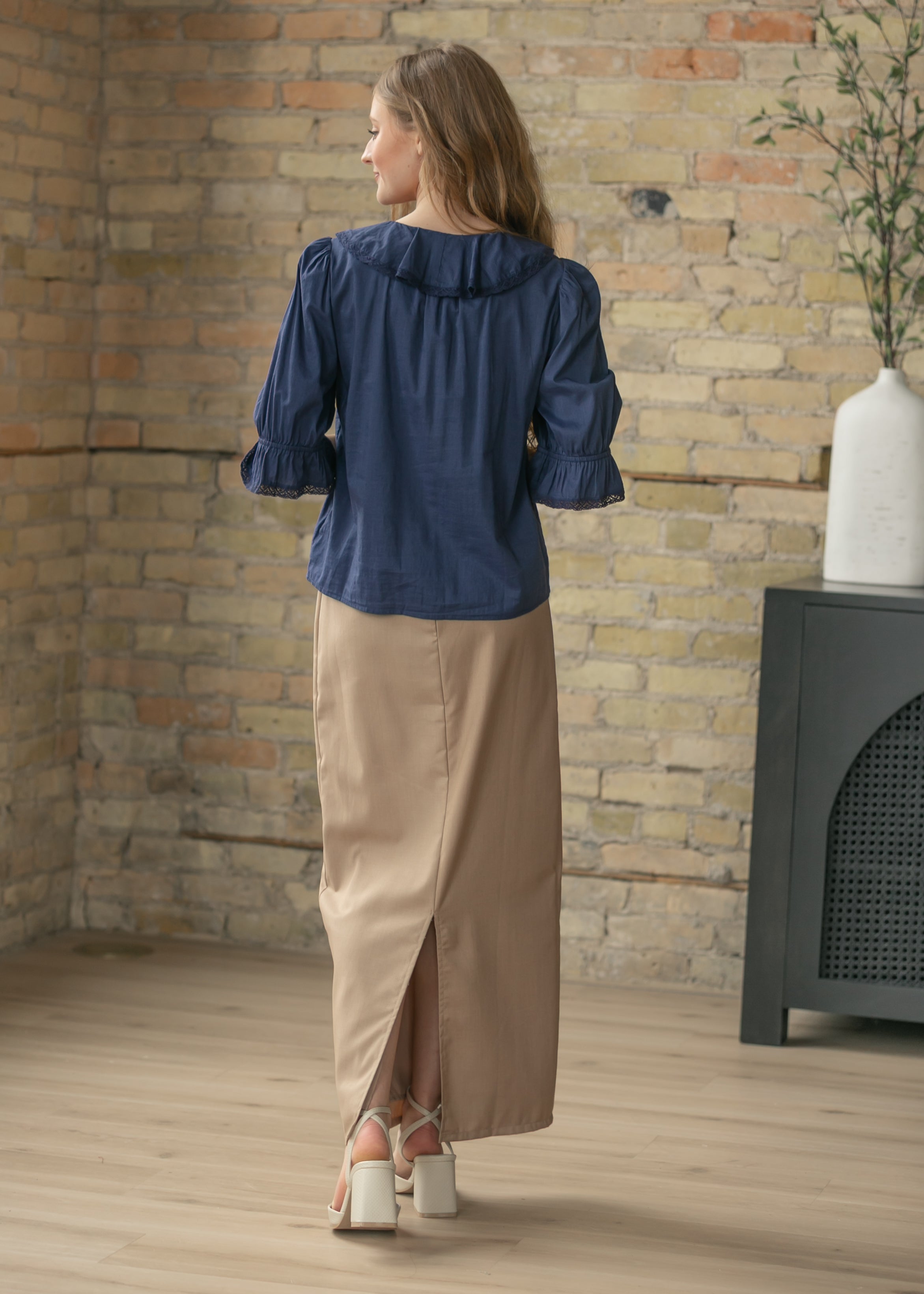 Detailed view of the Hollis Long Maxi Skirt's waistband and closure, emphasizing its comfortable and secure fit.